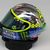 Valentino Rossi met son casque au vert à l'occasion de son Grand-Prix national